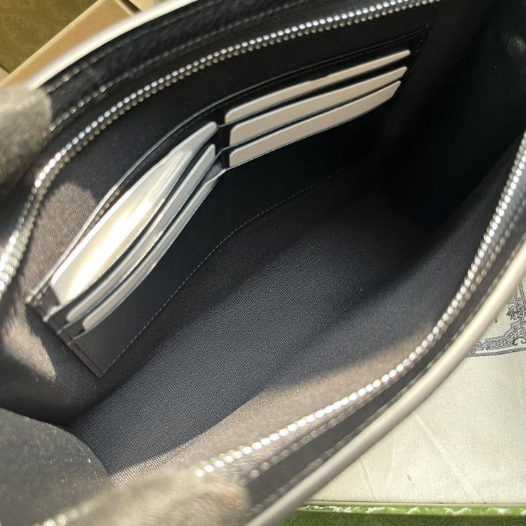 Pochette GG “Con set completo di confezione originale in scatola verde”.