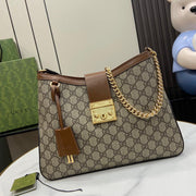 Borsa a tracolla media Gucci serie Padlock GG