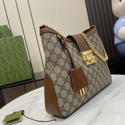 Borsa a tracolla media Gucci serie Padlock GG