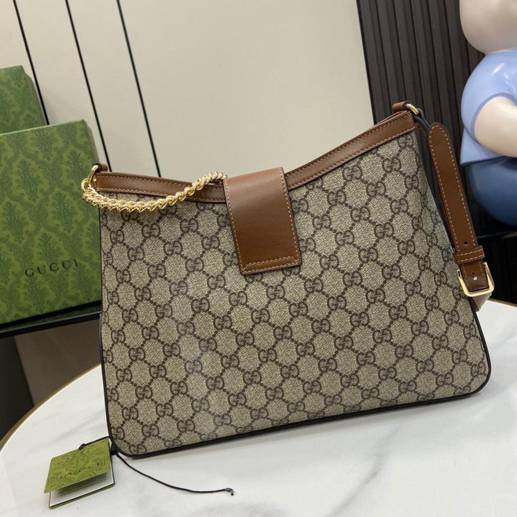 Borsa a tracolla media Gucci serie Padlock GG