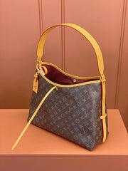 Louis Vuitton Alma Carryall MM in Tela Monogram