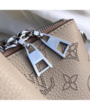 Louis Vuitton Borsa Haumea in Pelle Traforata Mahina - Beige